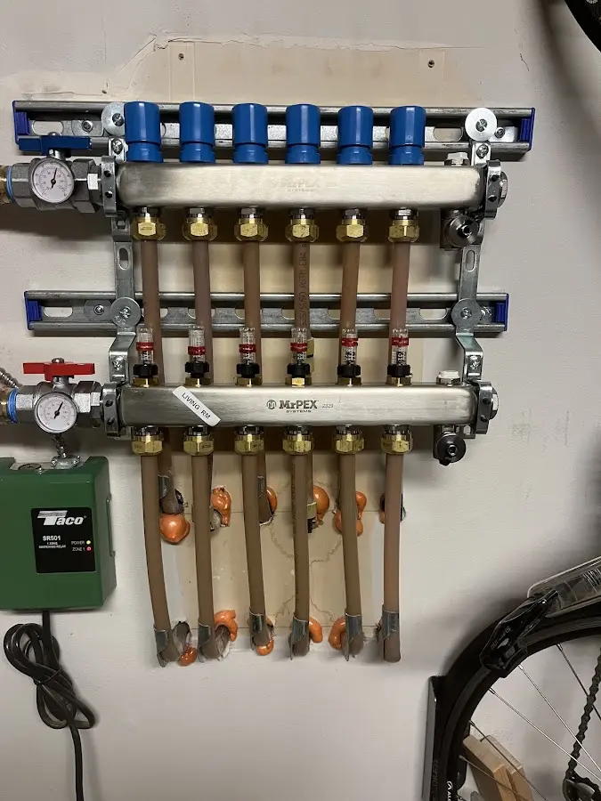 Plumber performing Leak Detection at a residential property in Bedford